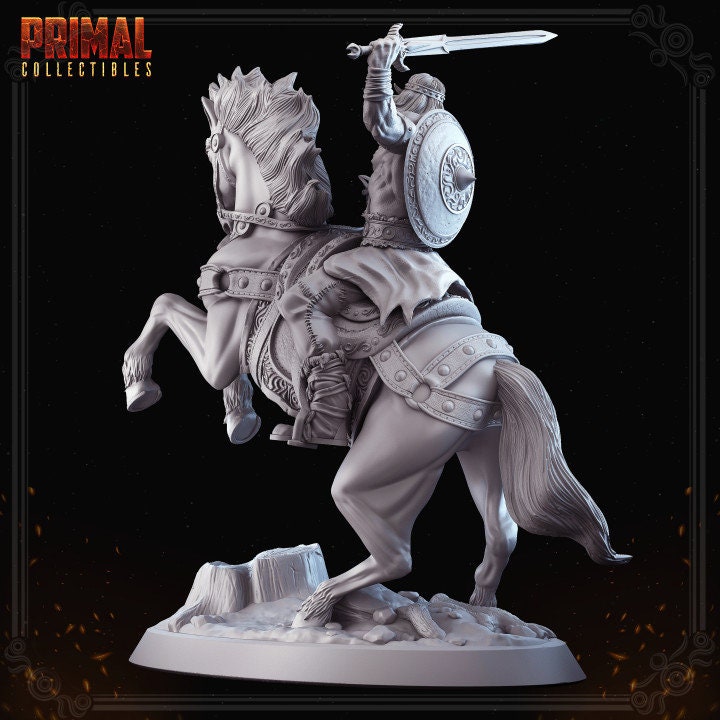 a statue of a man on a horse with a sword