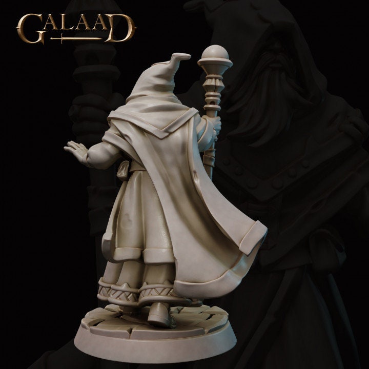 a statue of a wizard holding a candle
