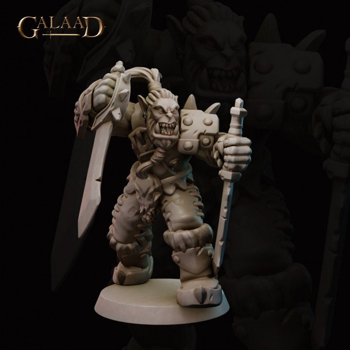 a statue of a demon holding a sword