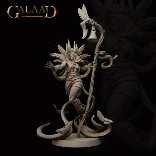 a statue of a person holding a staff