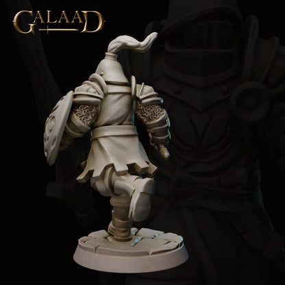 a close up of a statue of a person holding a sword