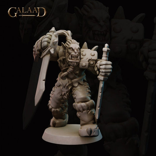 a statue of a demon holding a sword