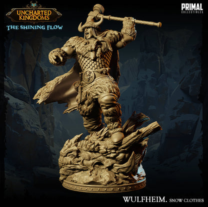 a statue of a man with a sword on top of a mountain